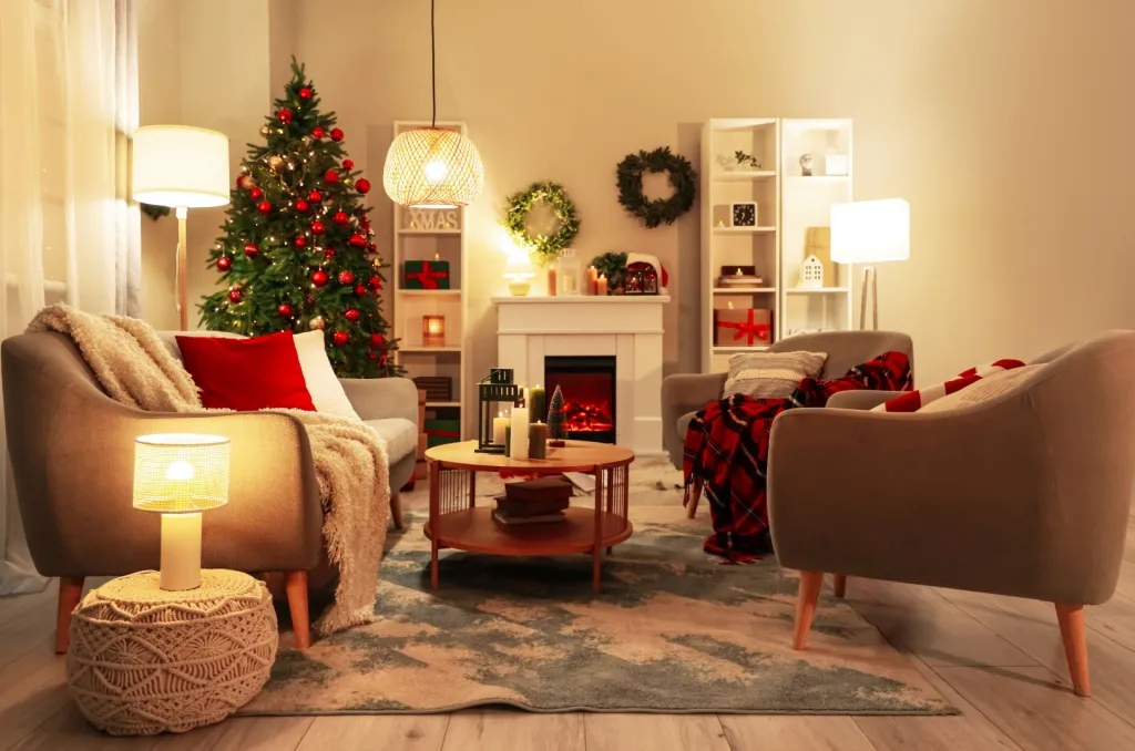 Warm, decorated living room with Christmas tree and candles, showcasing best practices for holiday safety around lights and seasonal decorations.