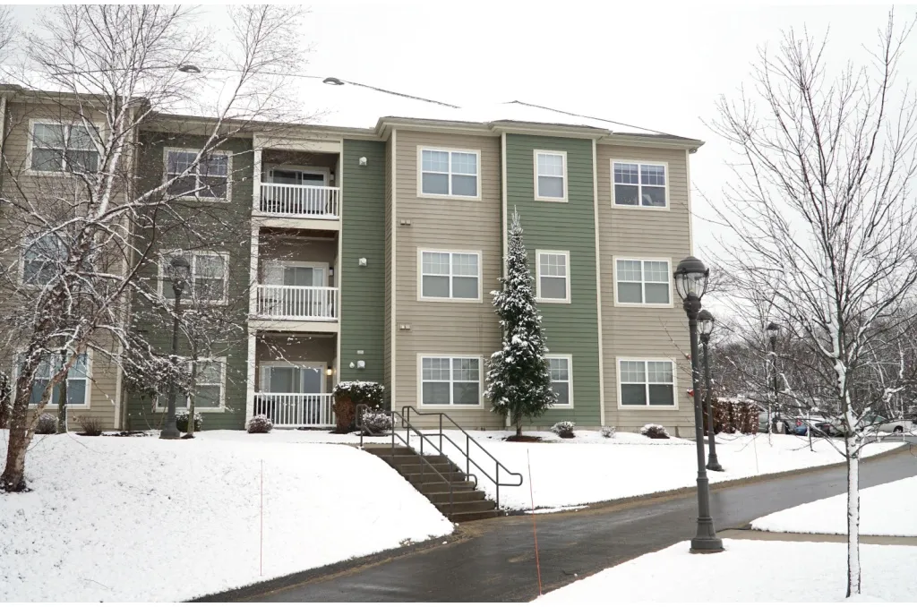 “Apartment complex blanketed in snow after a storm, emphasizing safety planning and how to prepare for a winter storm in an apartment.