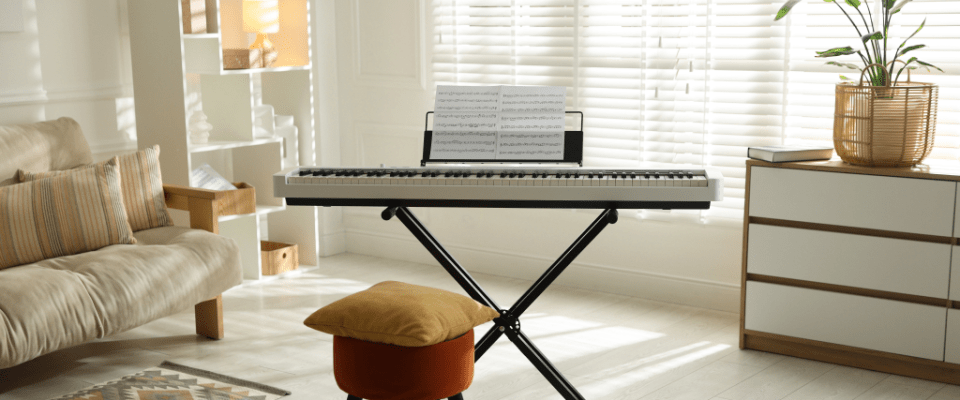 Modern living room with a sofa and a digital piano with musical sheet on a stand, highlighting what renters insurance doesn't cover fully, such as high-value musical instruments.