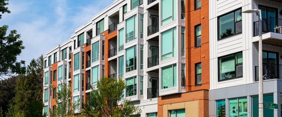Exterior view of a modern apartment building, with rental opportunities when researching the best time to rent an apartment.