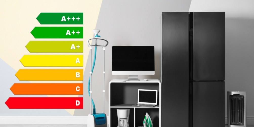 Various household appliances, including a refrigerator, laptop, iron, heater, and coffee maker, displayed next to a colorful energy efficient rating chart.