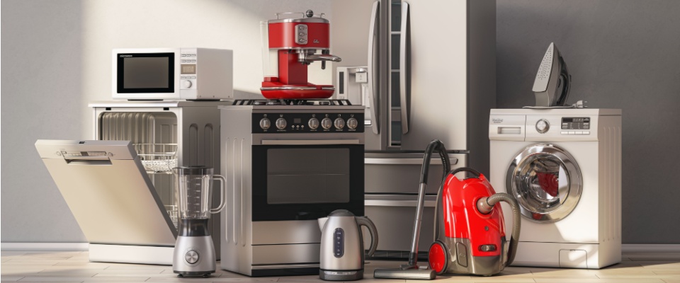 Collection of household appliances including a refrigerator, oven, dishwasher, and washing machine, representing some items that are usually not covered by renters insurance.
