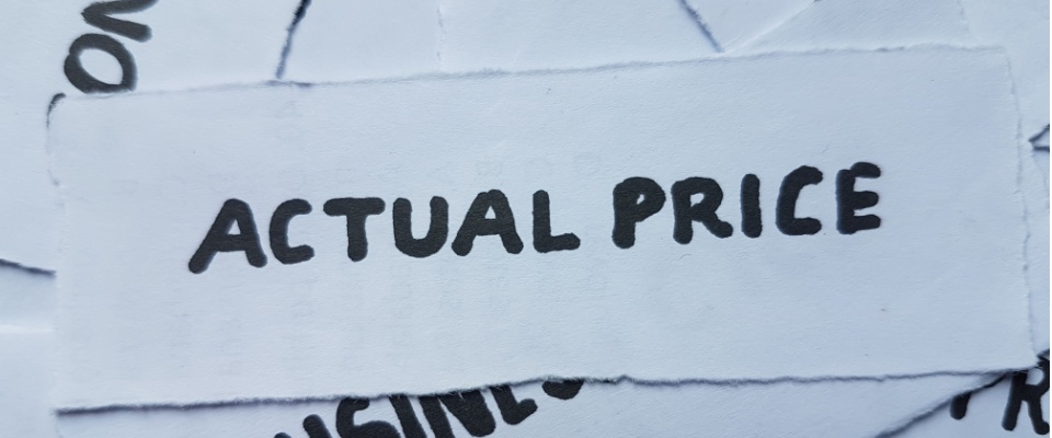 Paper labeled ‘actual price,’ representing the difference between actual cash value and replacement cost when you compare renters insurance policies.