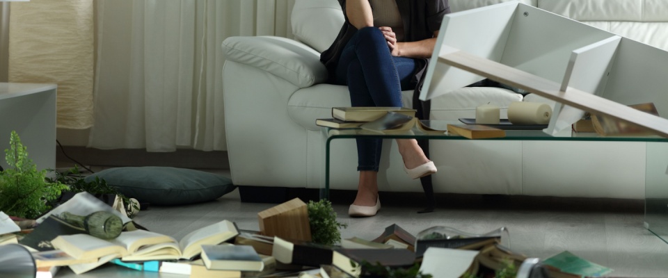 Damaged living room furniture and scattered belongings illustrating situations where understanding what may be deductible in the case of certain losses such as vandalism.