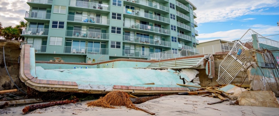 Severe storm damage to a beachfront apartment property, highlighting the importance of understanding renters insurance in Florida and what it covers.